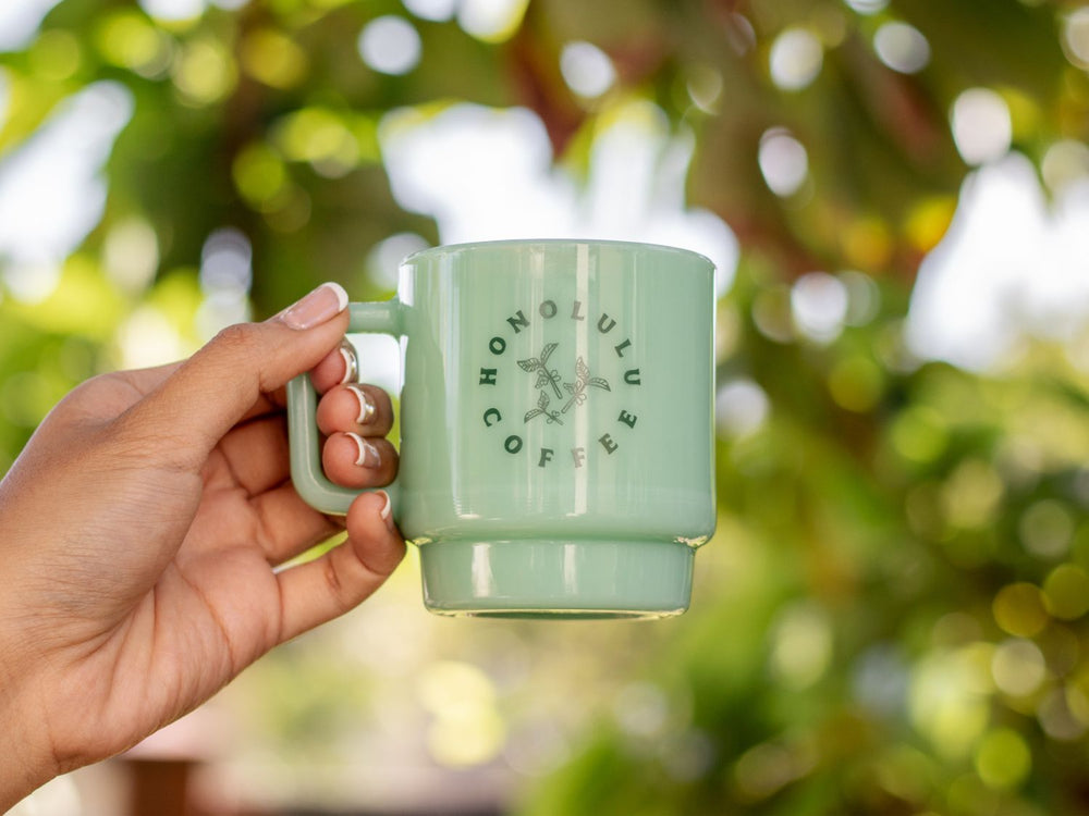 Green Milk Glass Mug with Honolulu Coffee's coffee branch design